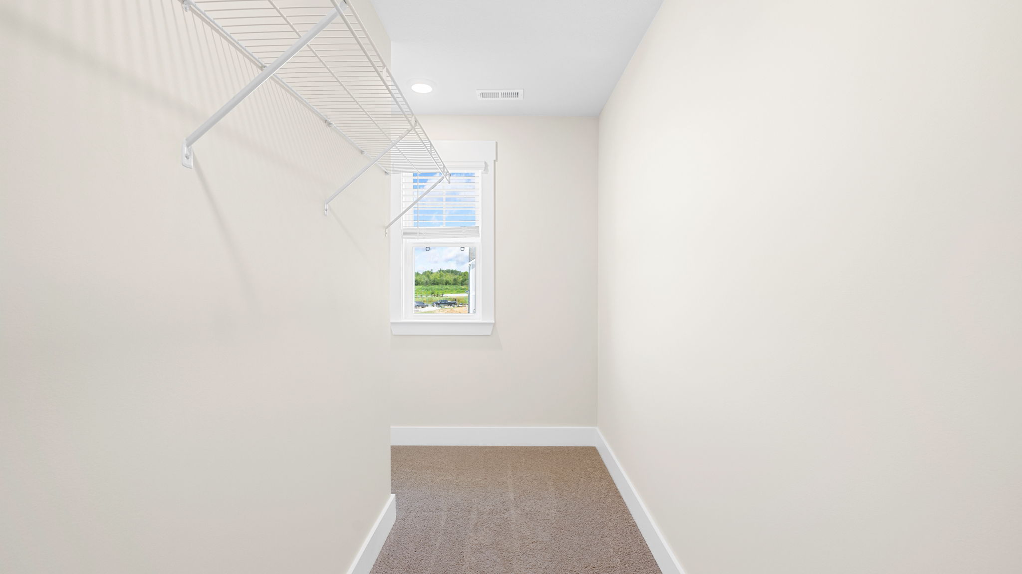 primary closet with shelving