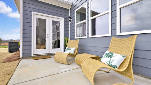 Back patio staged with lounging chairs