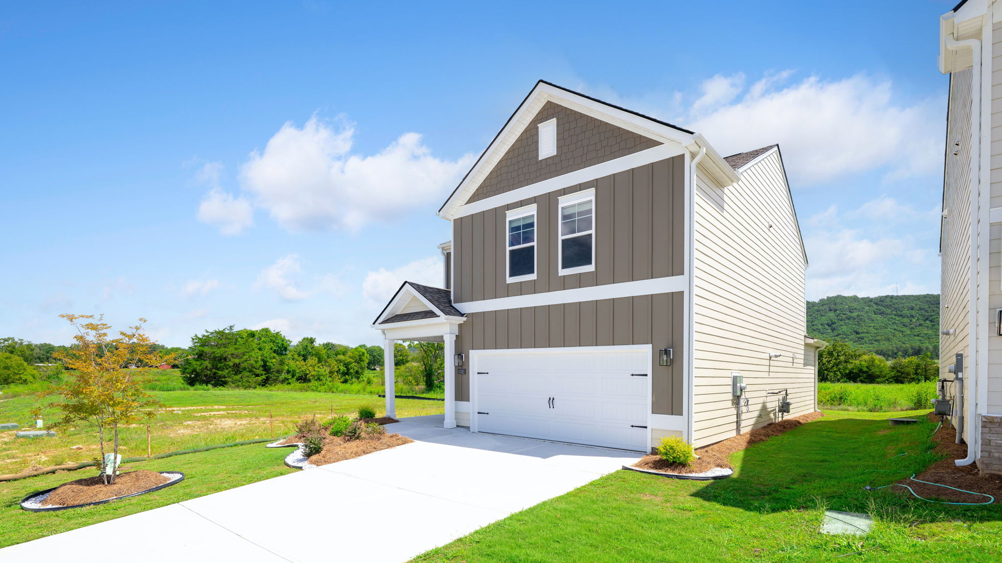 exterior of two story home with board and batten