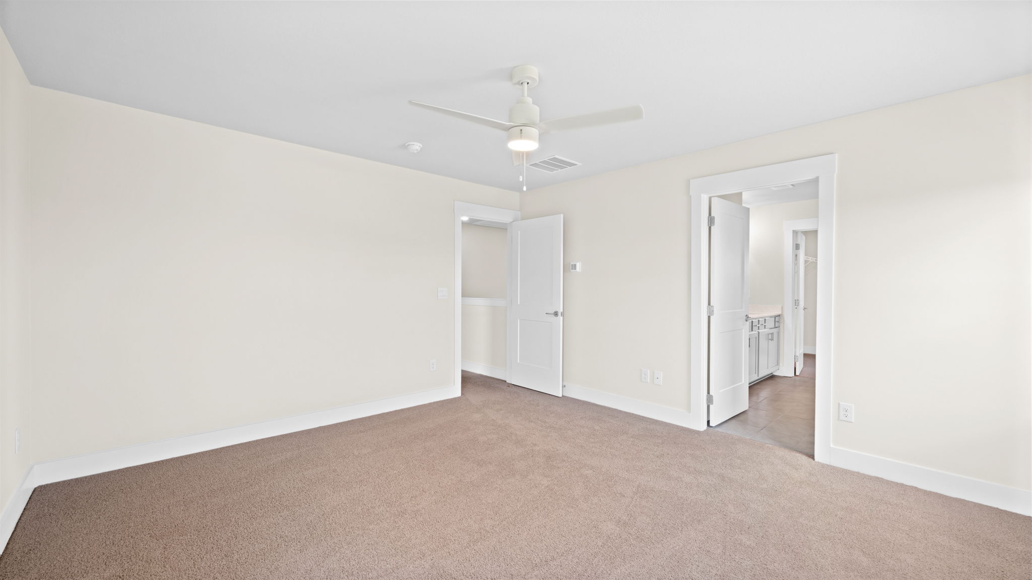 primary bedroom with carpet