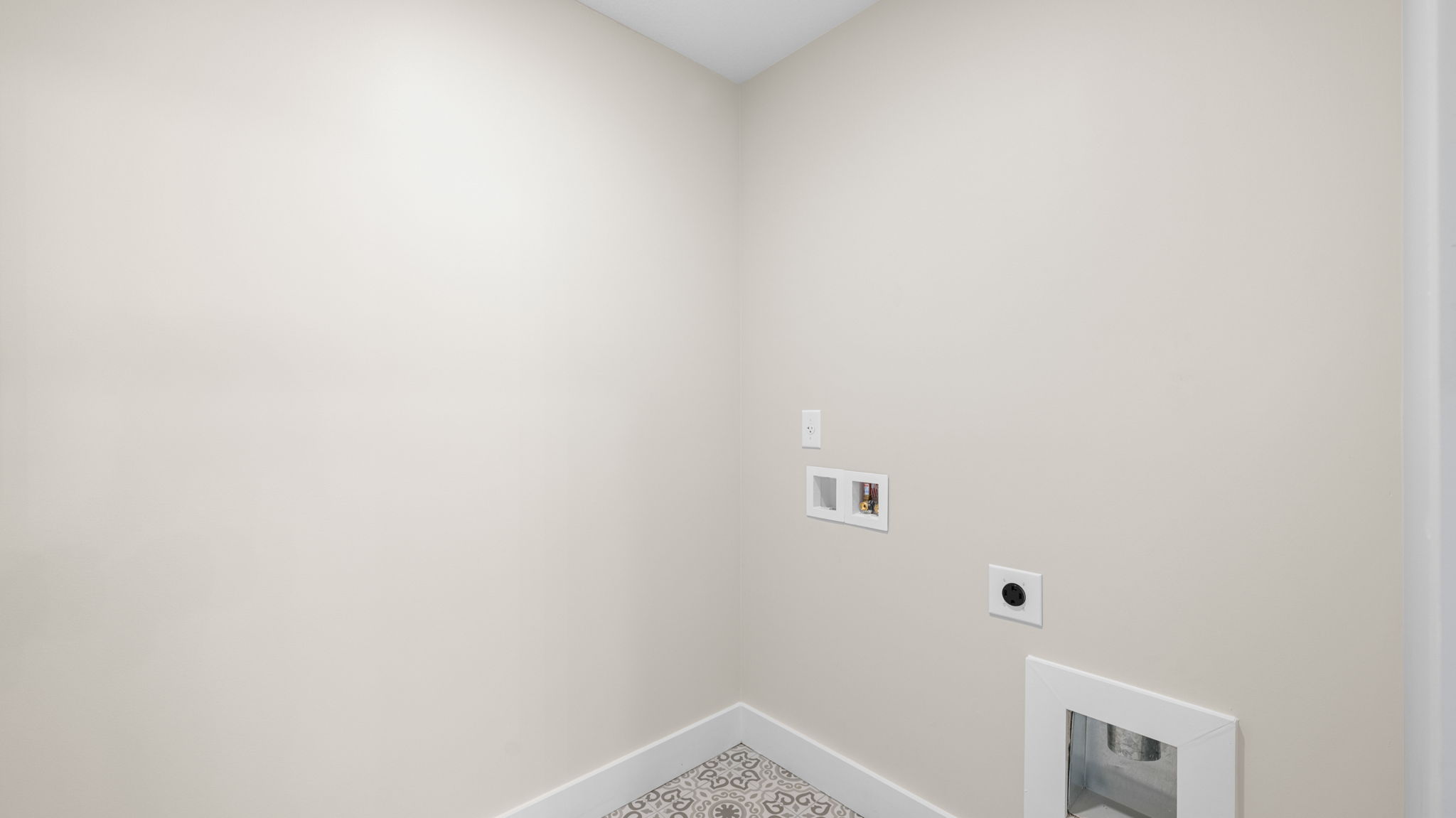 laundry room with tile