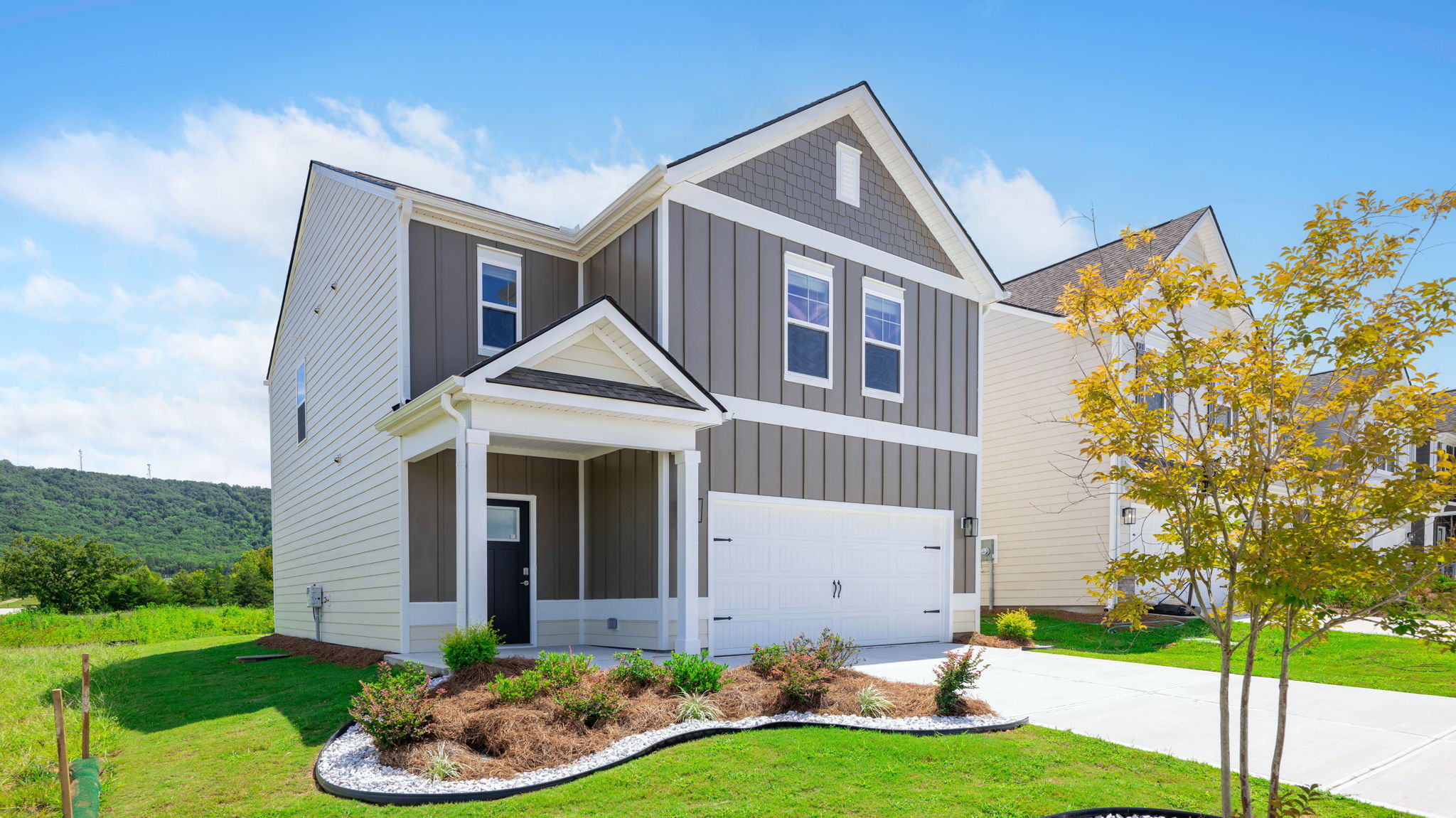 exterior of two story home with board and batten