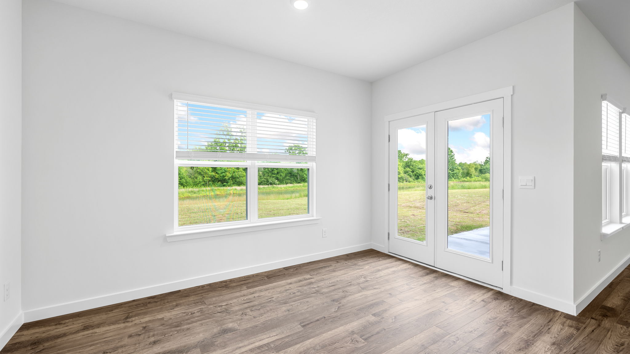 the breakfast nook has solid flooring and lots of natural light