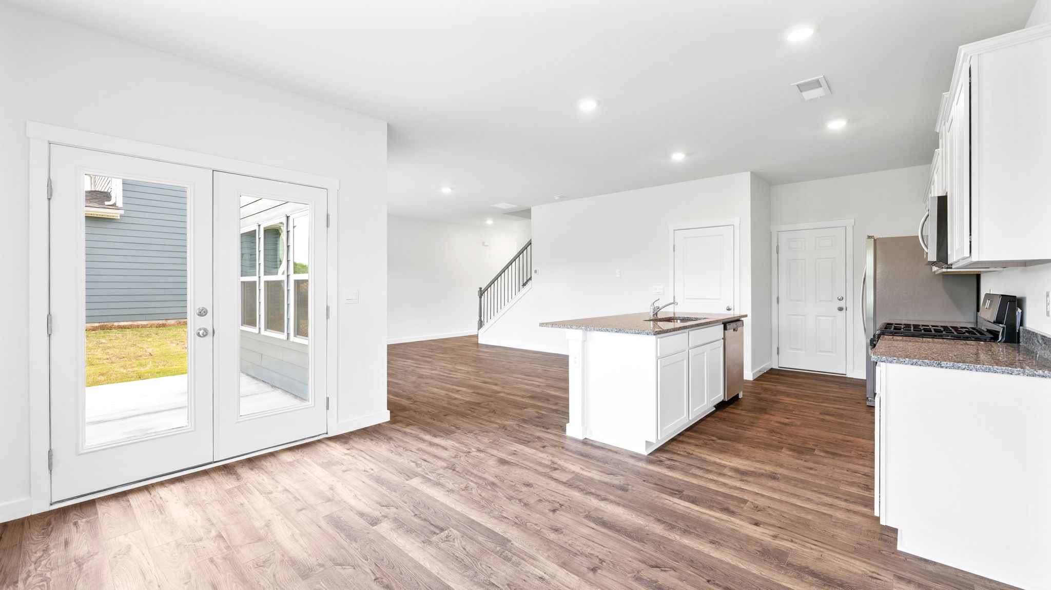 the breakfast area is adjacent to the kitchen and has recessed lighting