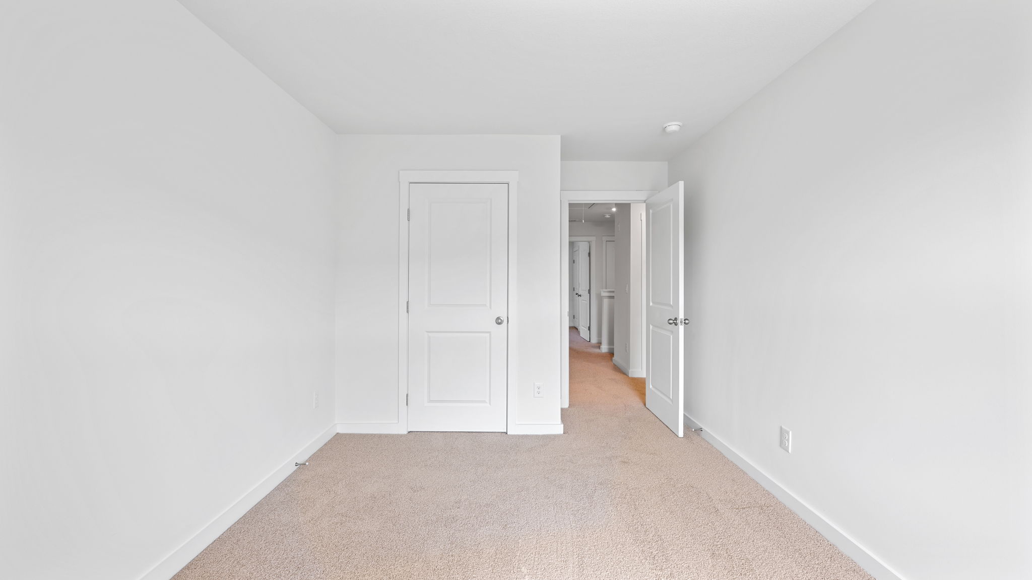 the bedroom leads to the open door