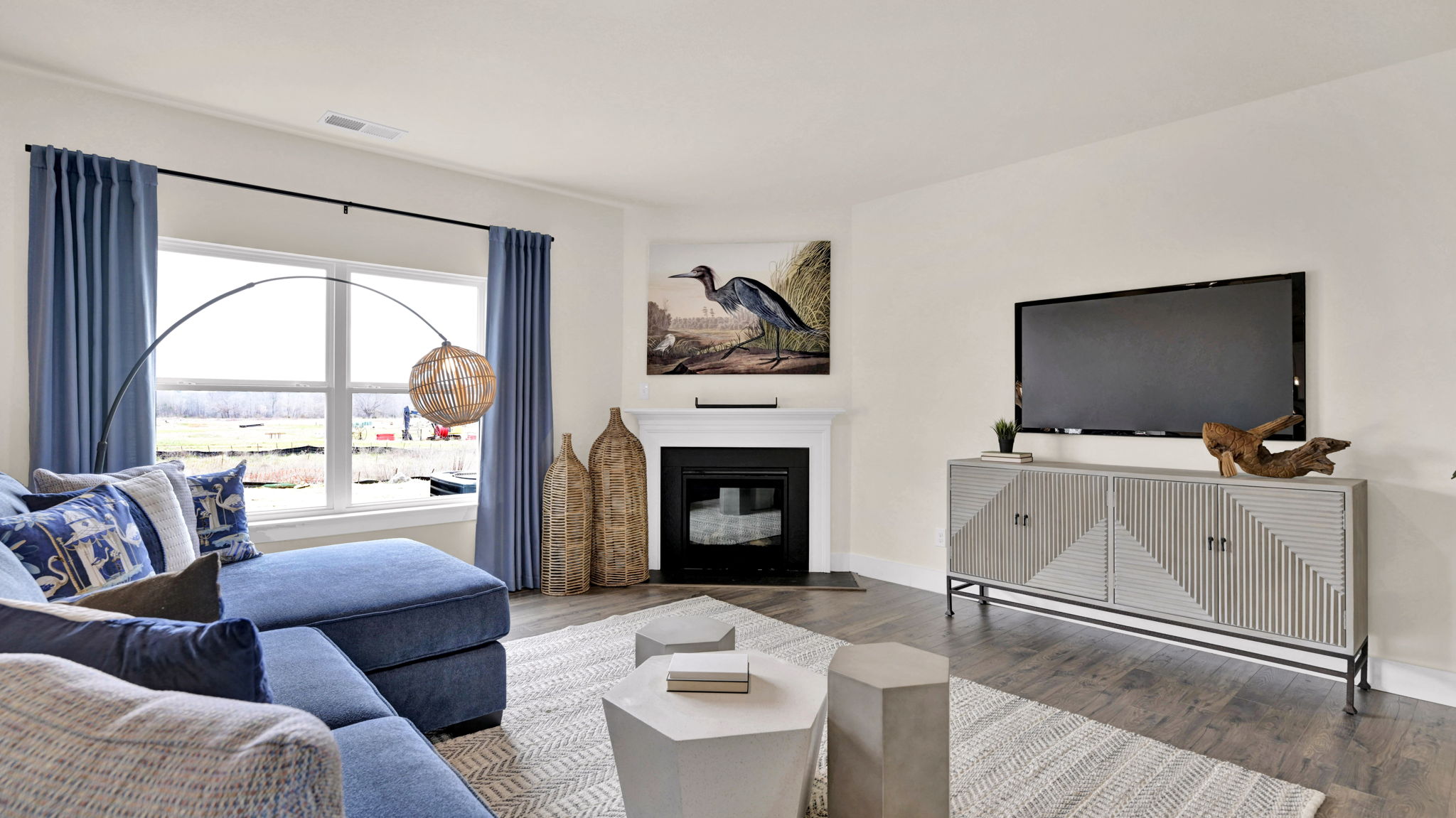 Living area with blue couch and television