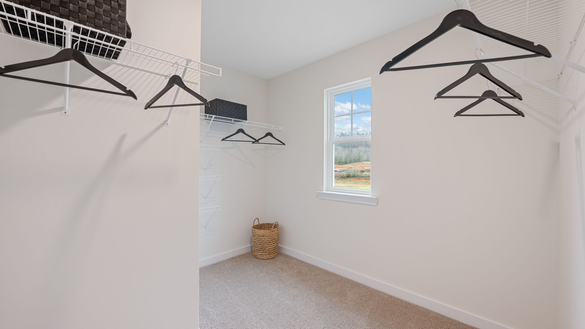 primary walk-in closet with window