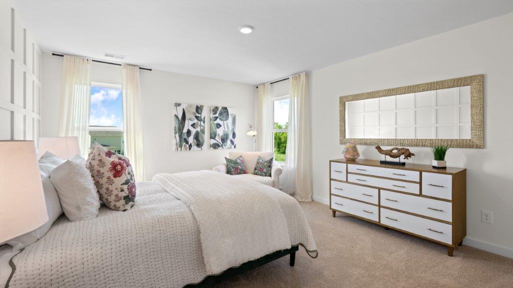 bedroom with two single windows and walk in clsoet