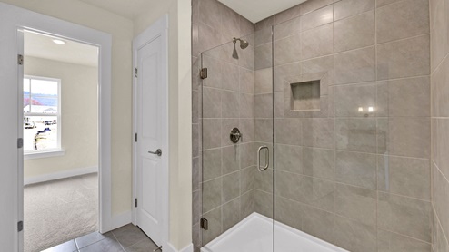 Primary bathroom with tile shower
