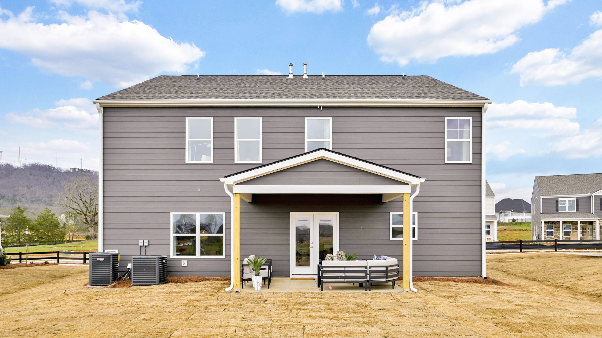 exterior of two story home and back porch