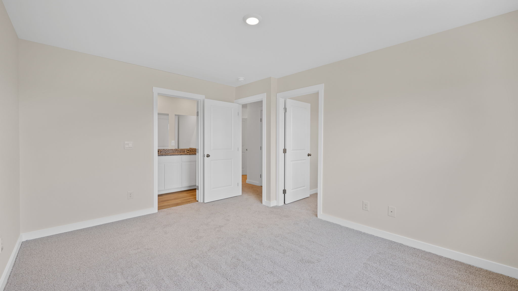 Primary bedroom with carpet