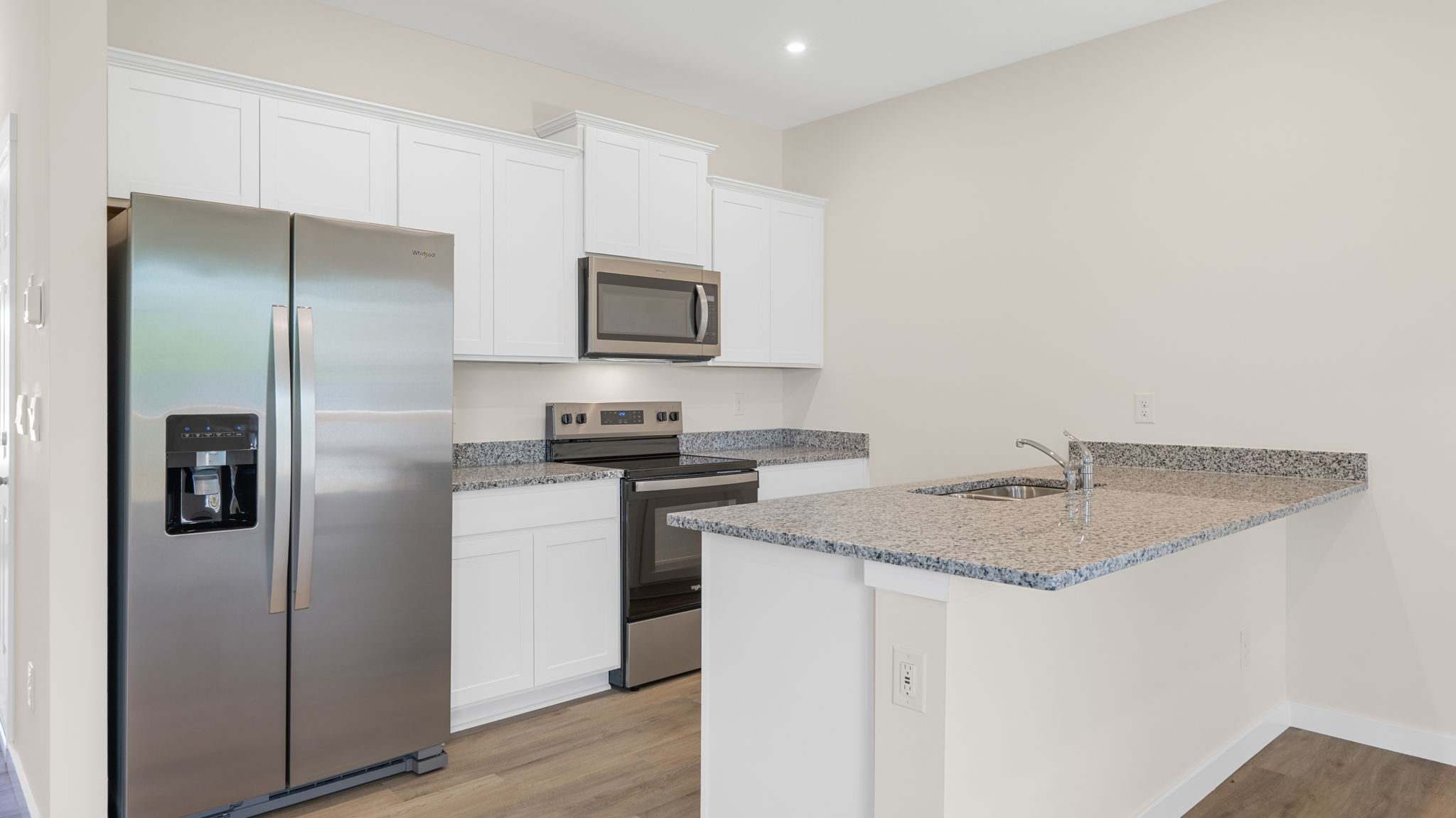 Kitchen with granite countertop and stainless steel appliances