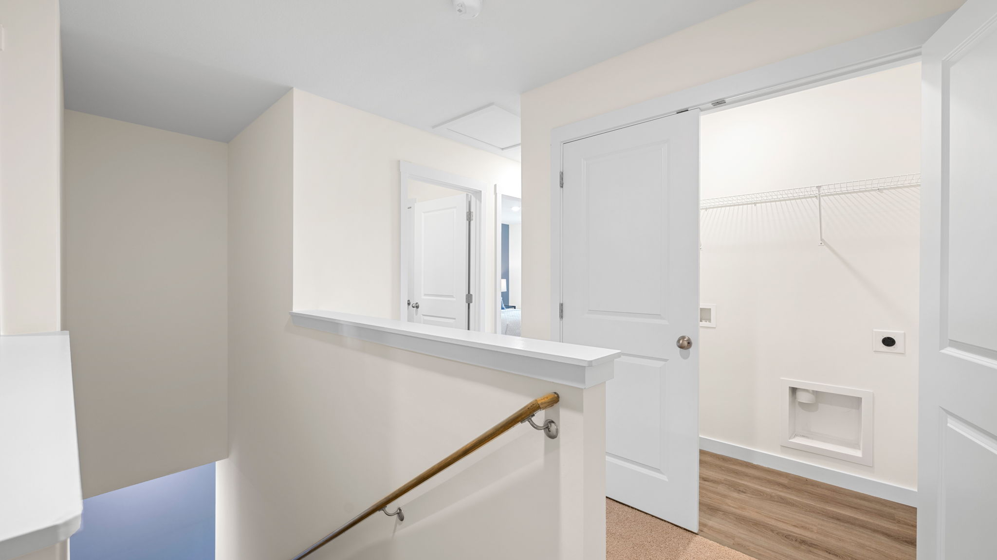 upstairs hallway with carpet