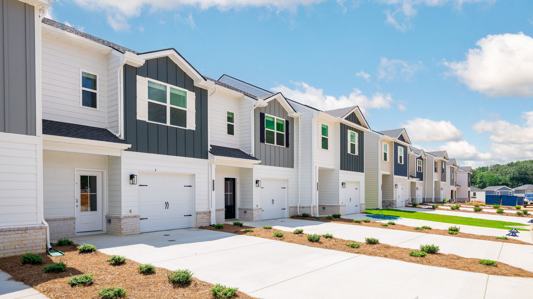 View of townhomes with neutral exteriors.