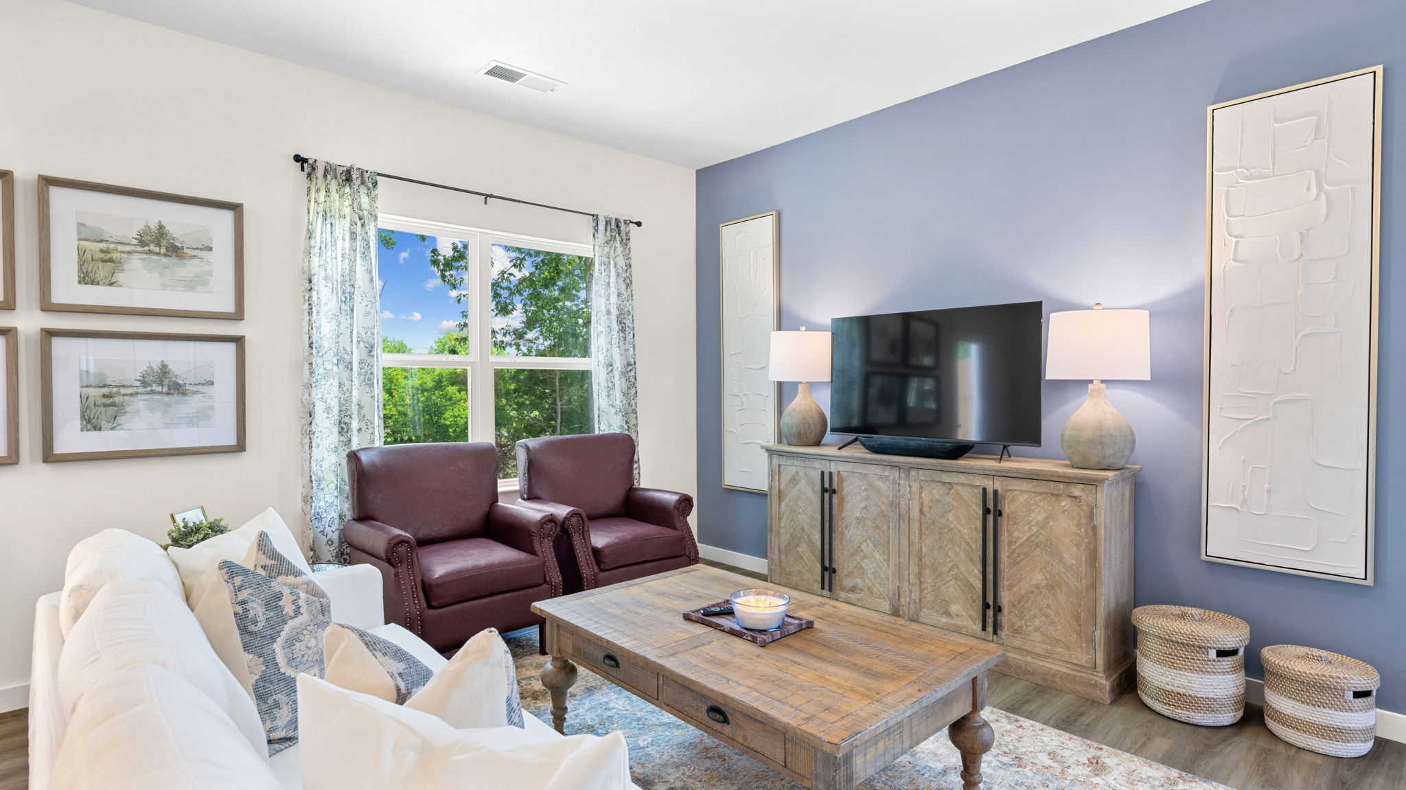 open concept dining and living area with windows and back patio door
