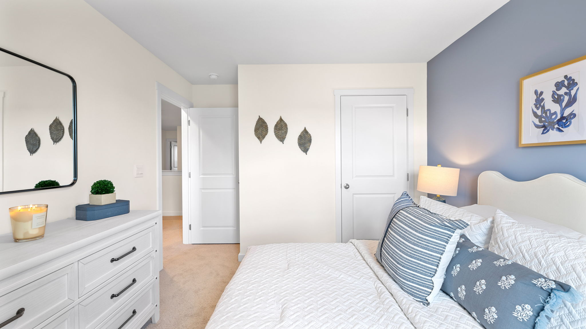 Bedroom with simple decor and a closet.
