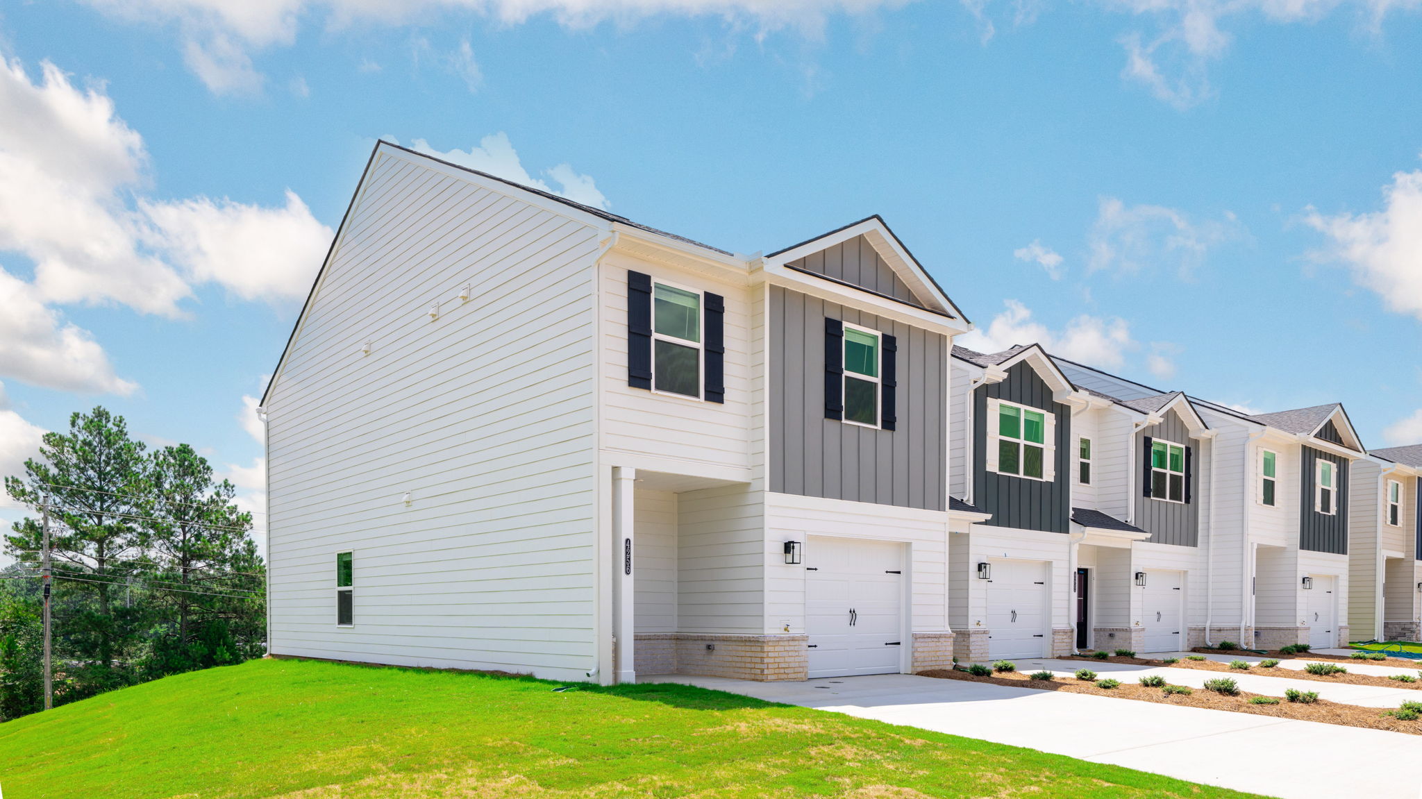 Side view of two story home with neutral exterior.