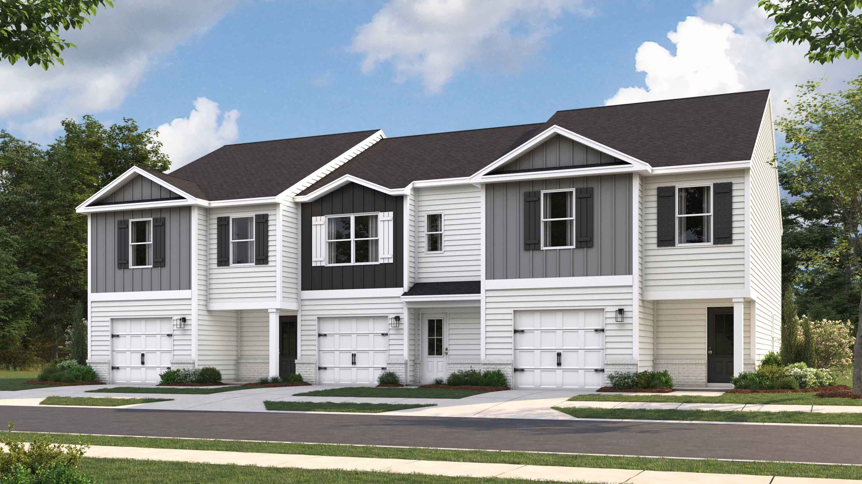 Exterior rendering of townhome units with blue sky