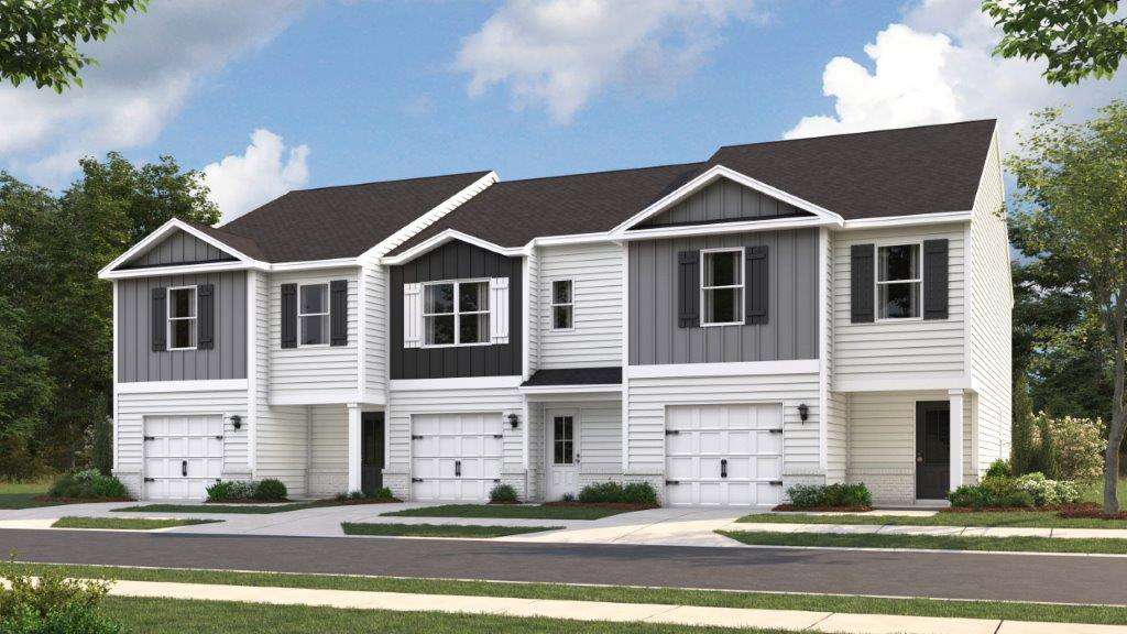 View of townhomes with neutral exteriors.