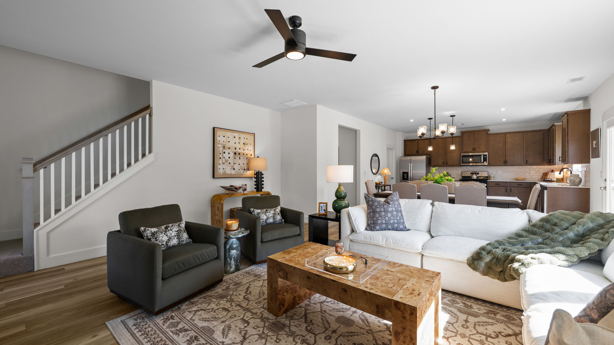 Open concept living room with stairs