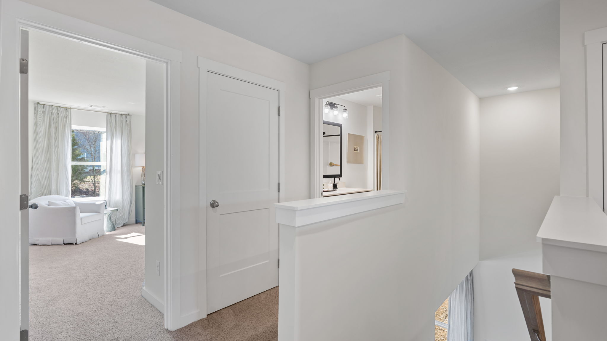 Upstairs hallway with carpet