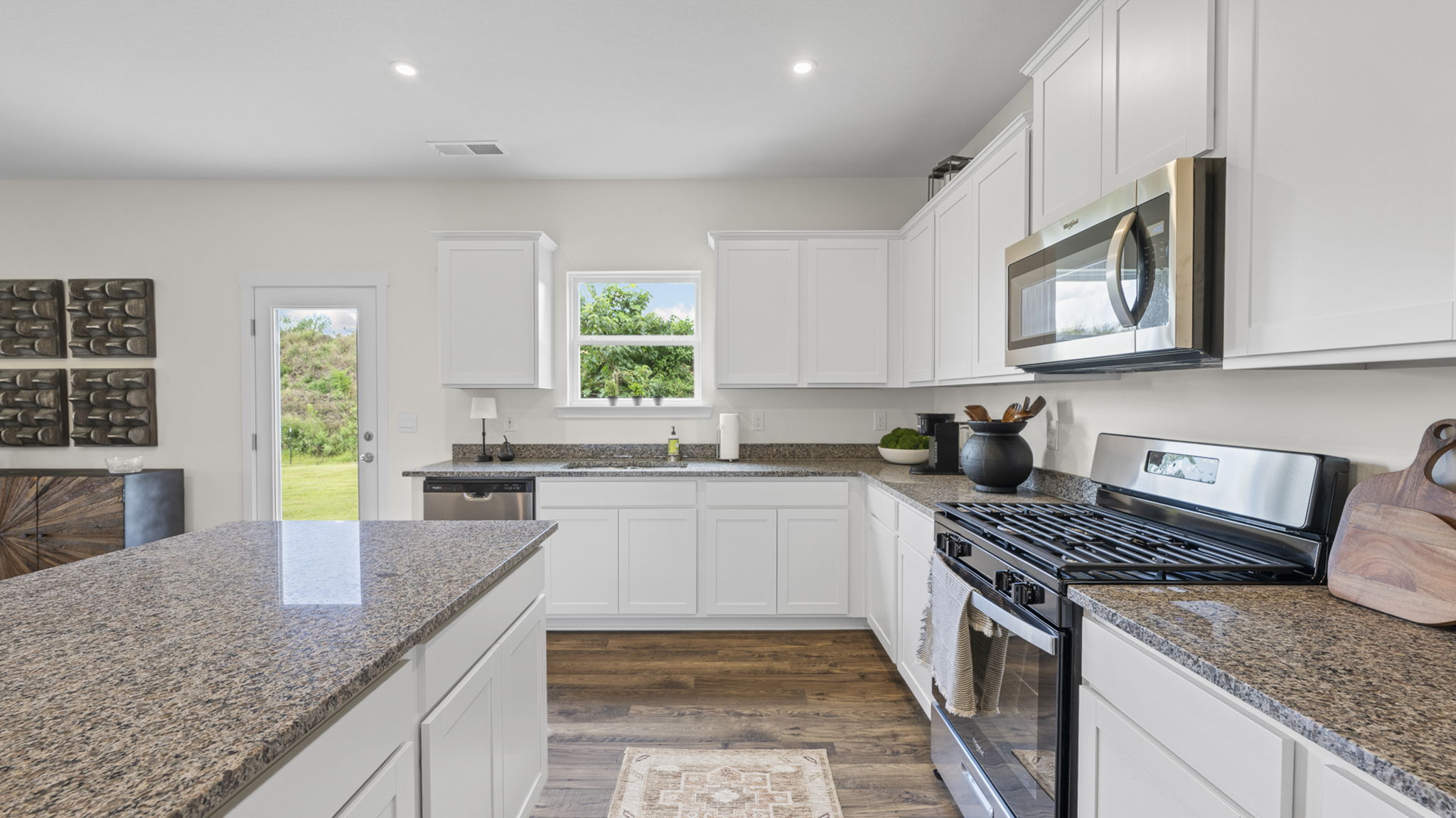 kitchen with single window and back patio door