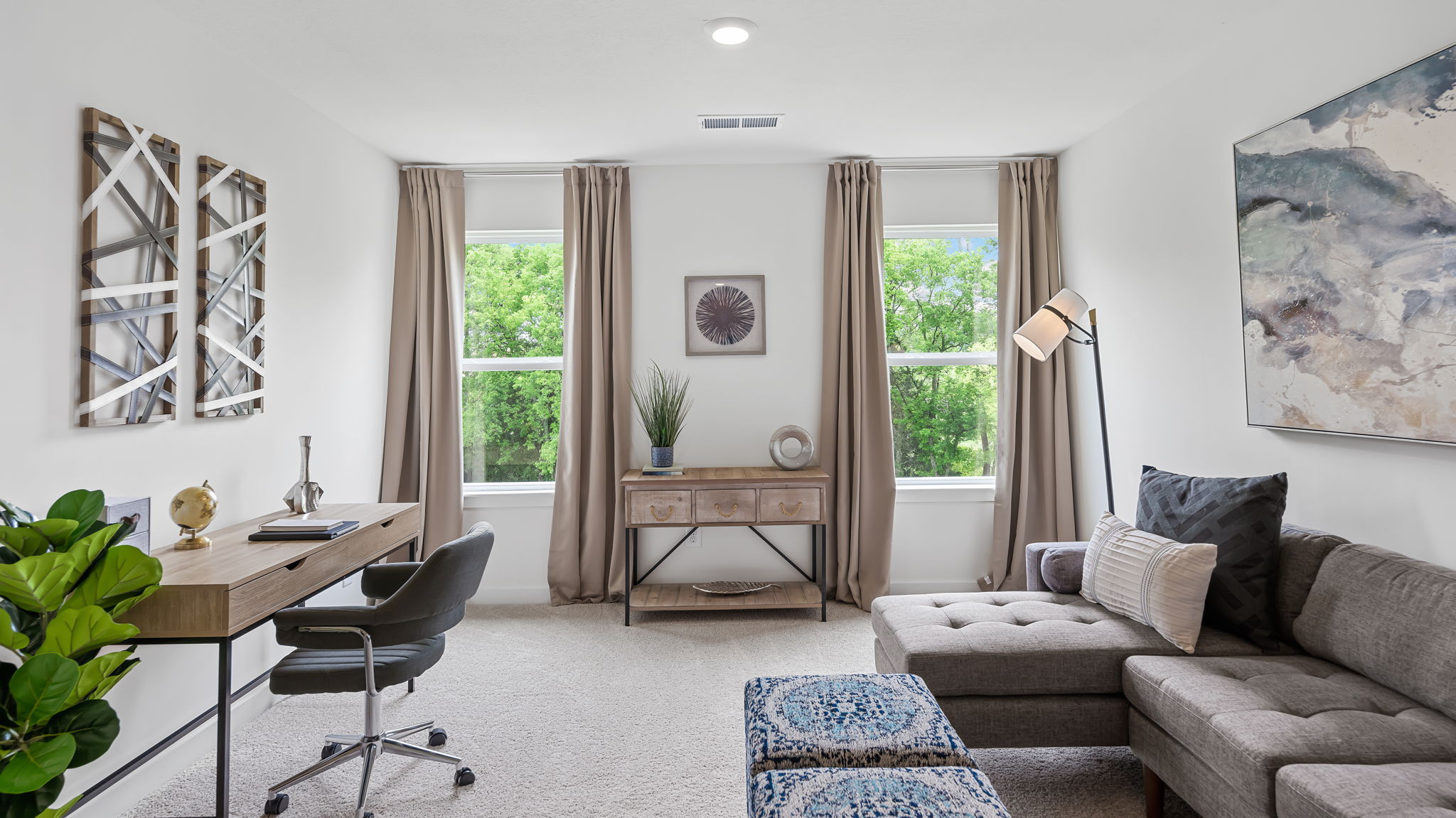 upstairs loft area with two windows
