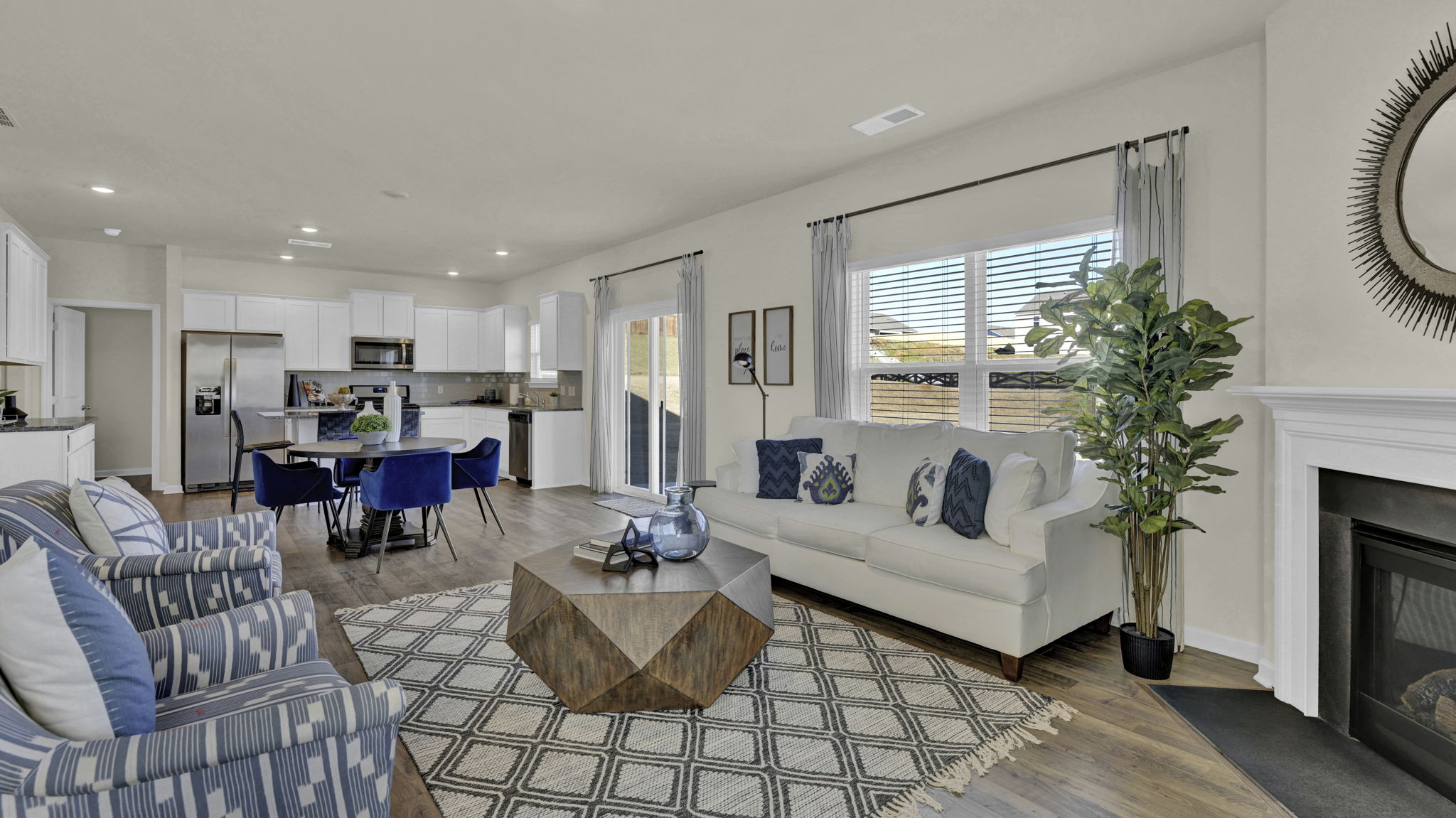 open concept living room wiith informal dining and kitchen