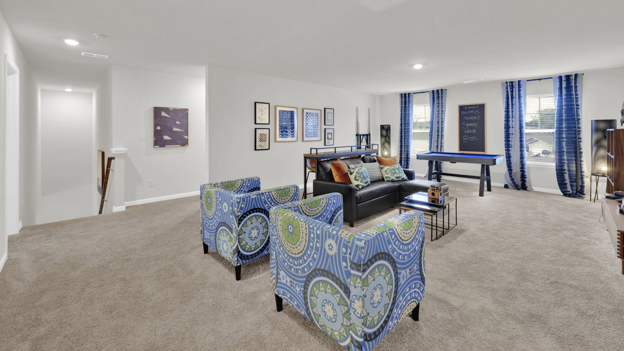 upstairs loft area with two windows