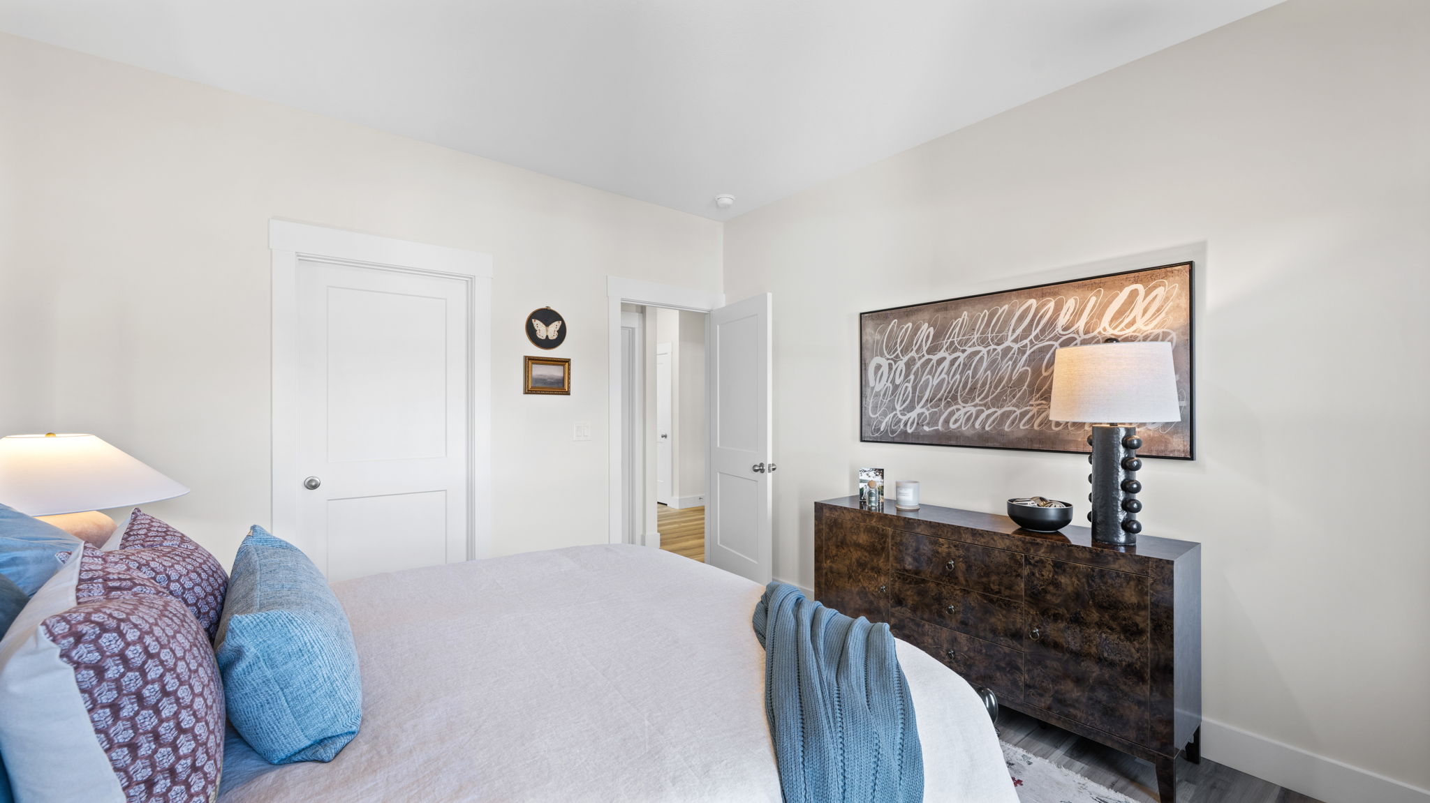 first floor bedroom with two single windows and walk-in closet