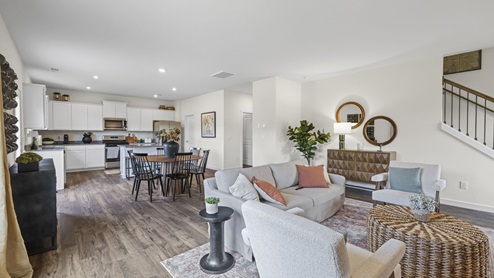 open concept living room with stairs on right