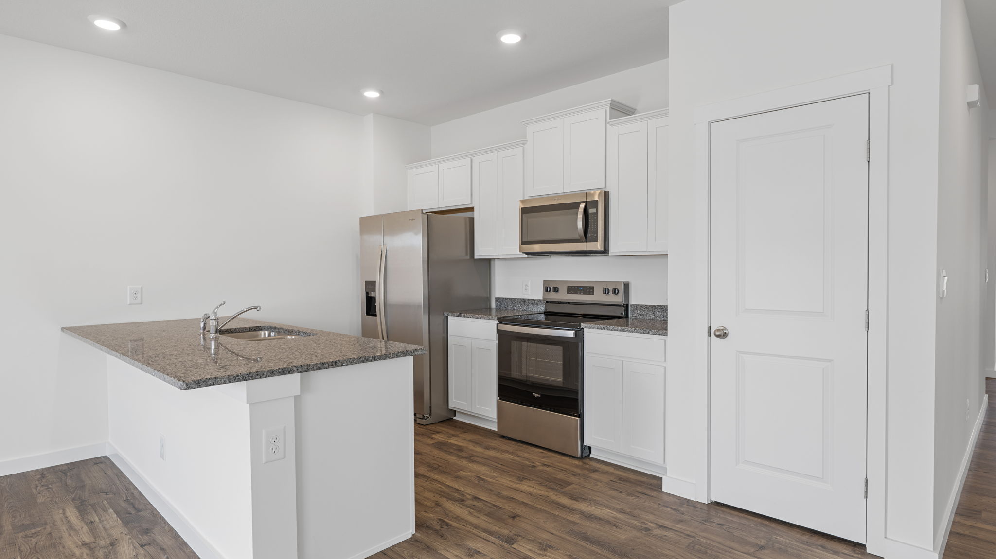 kitchen with walk-in pantry and stainless steel appliances