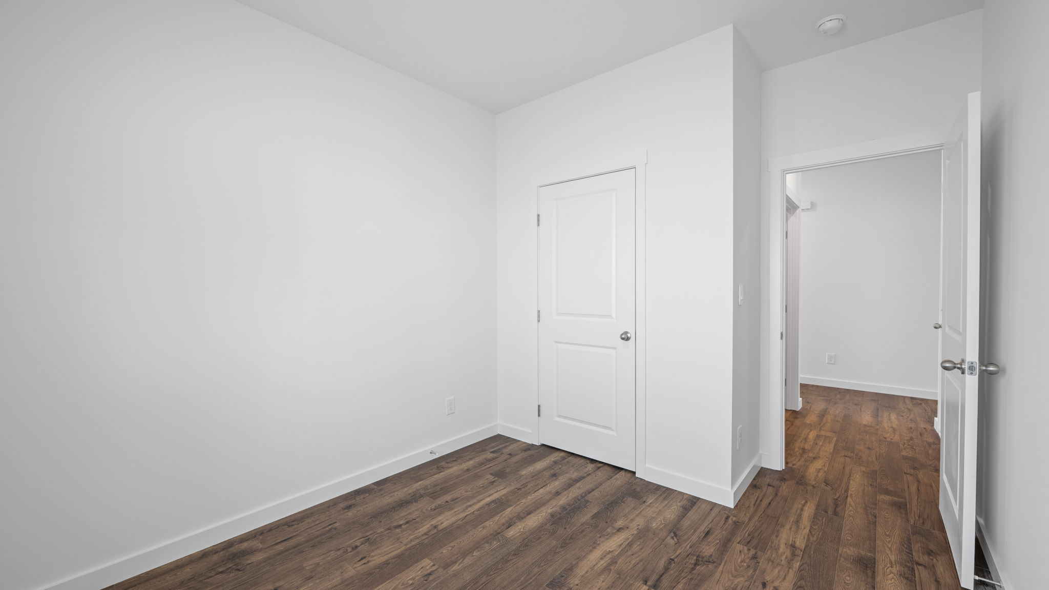 bedroom with single window and walk-in closet
