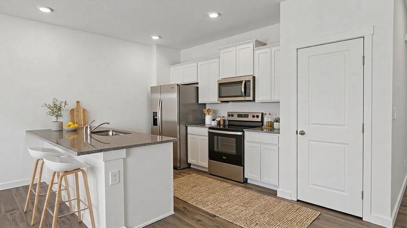 kitchen with stools at island