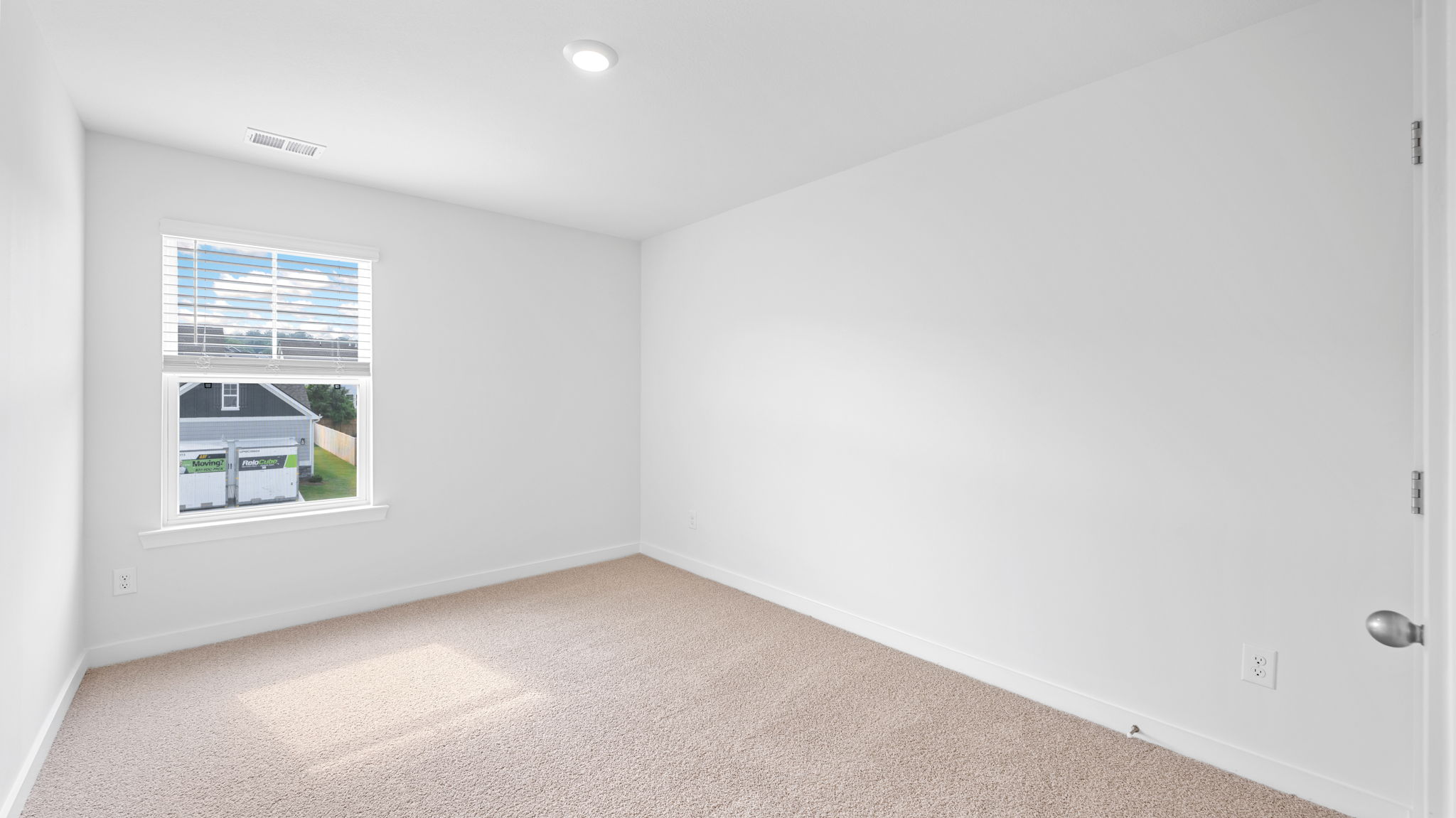 bedroom with single window and walk-in closet