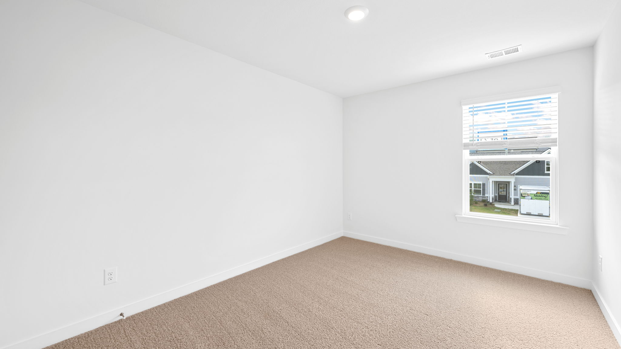 bedroom with single window and walk-in closet