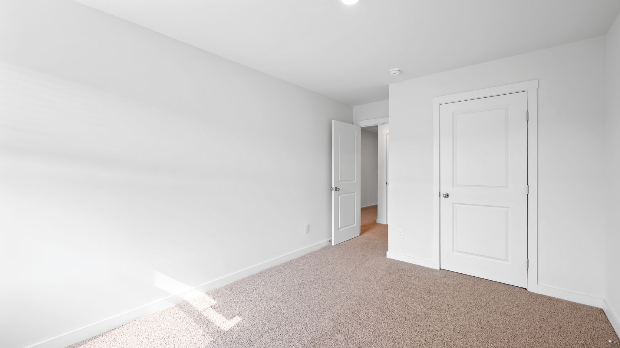 bedroom with single window and walk-in closet