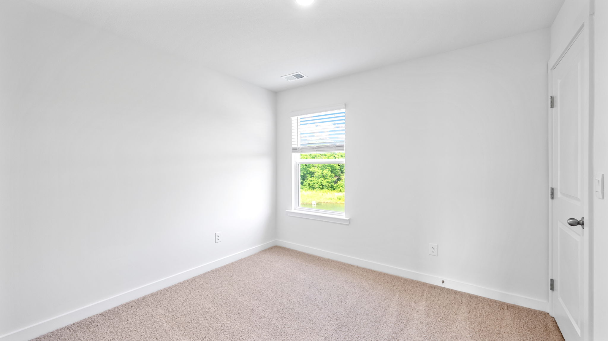bedroom with single window and walk-in closet