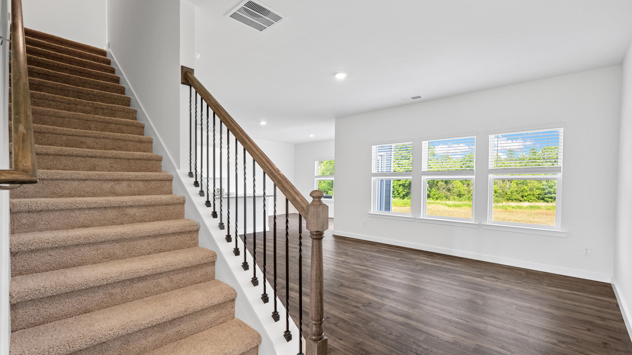 open concept living with stairs to the left