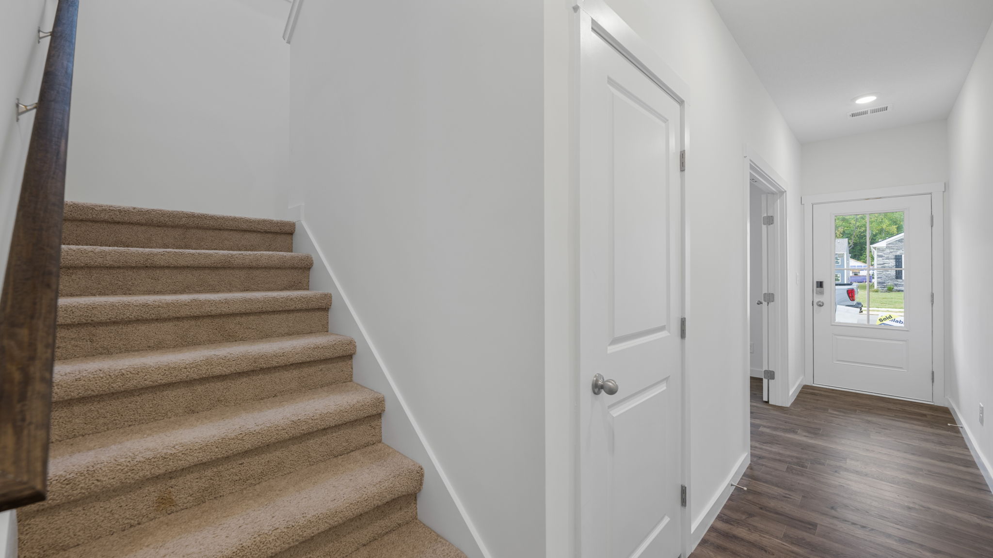 entryway hallway with stairs on left