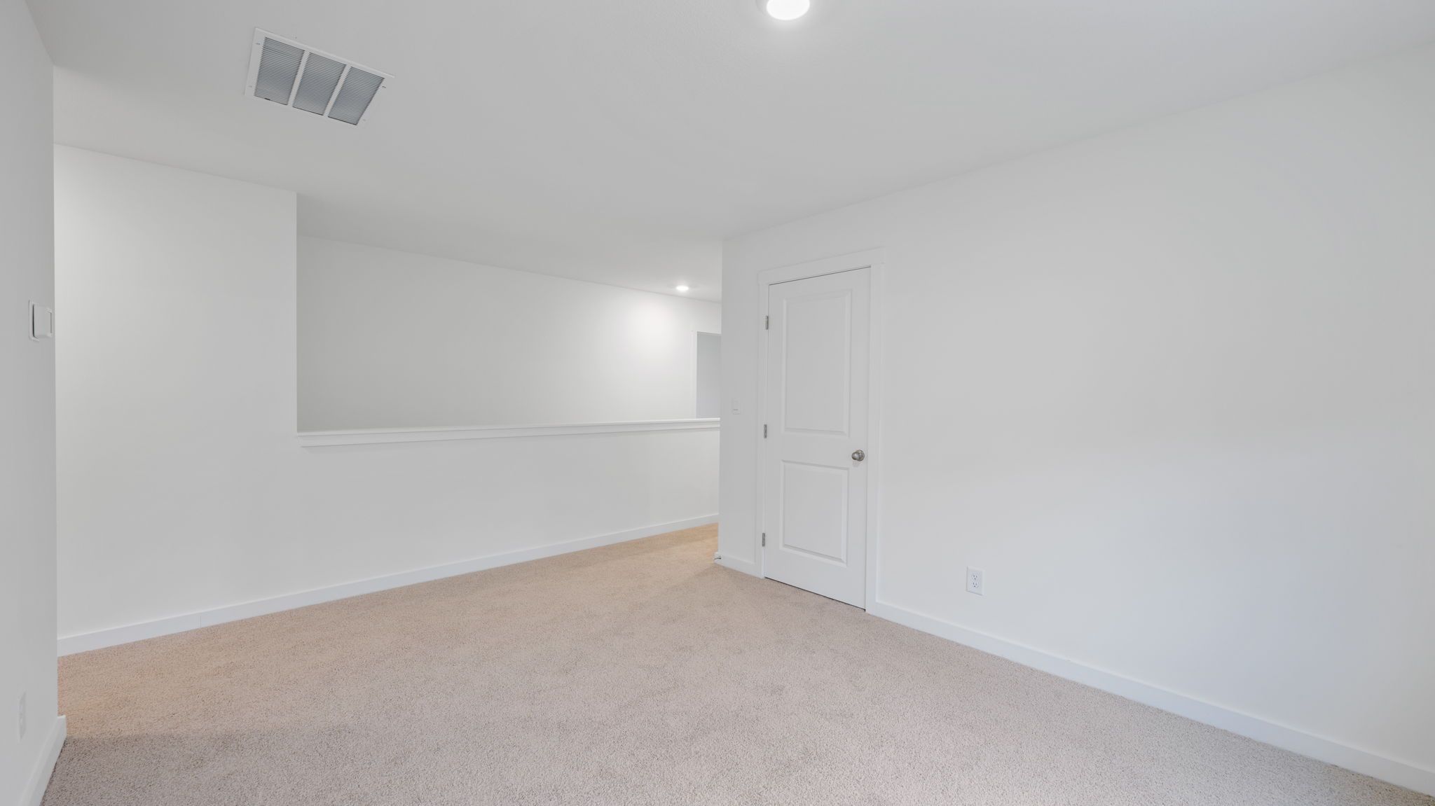 upstairs loft area with double window