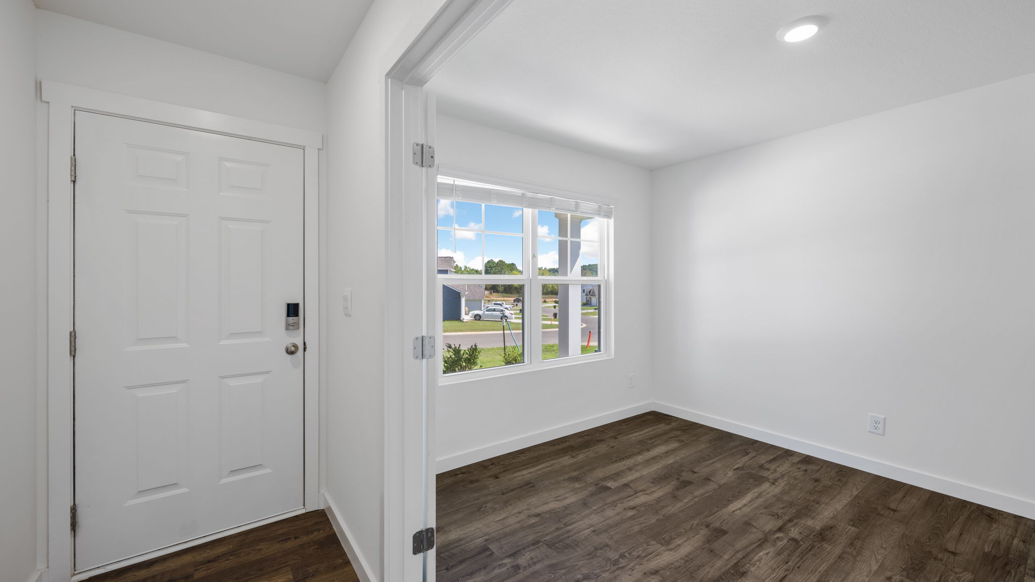 front room off entry way of home with double window