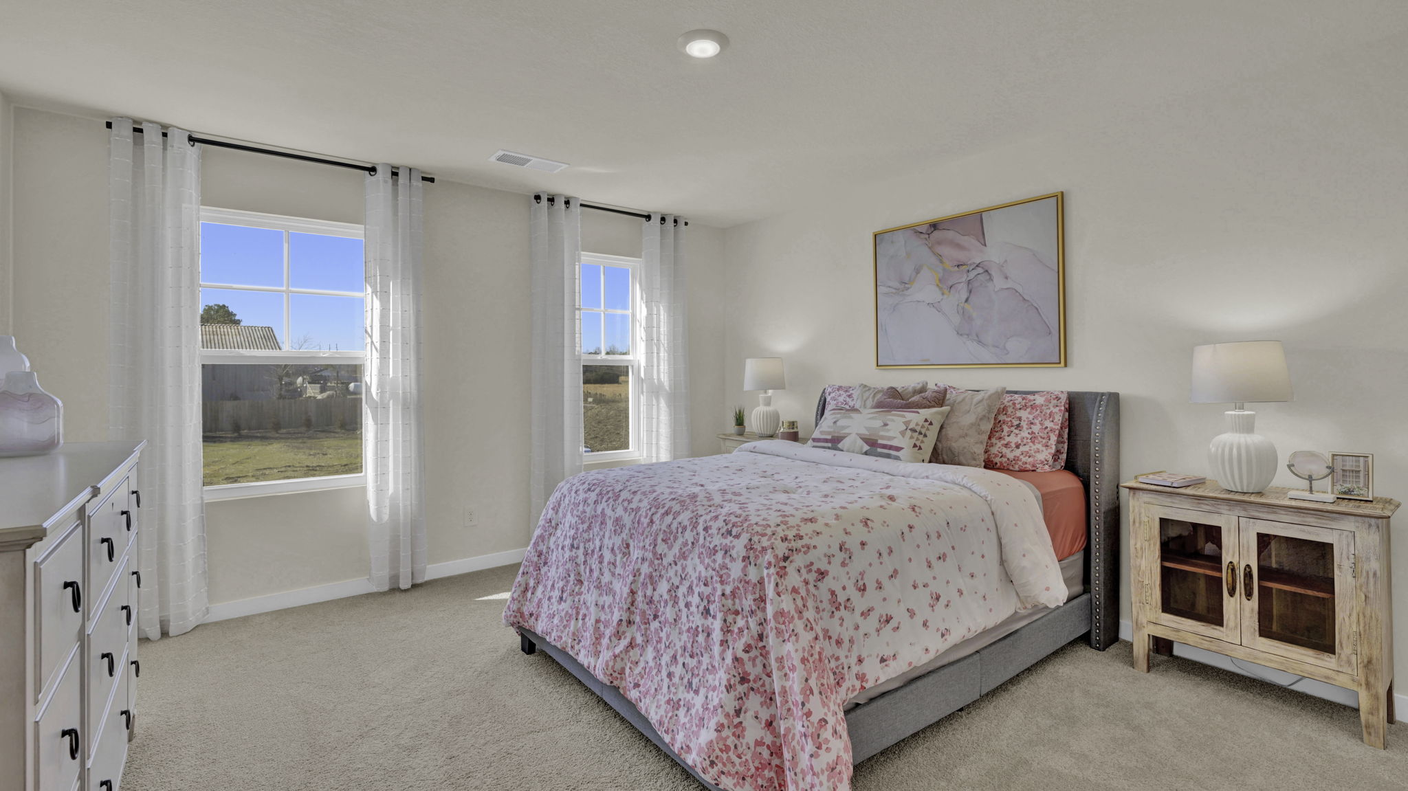 guest bedroom with windows