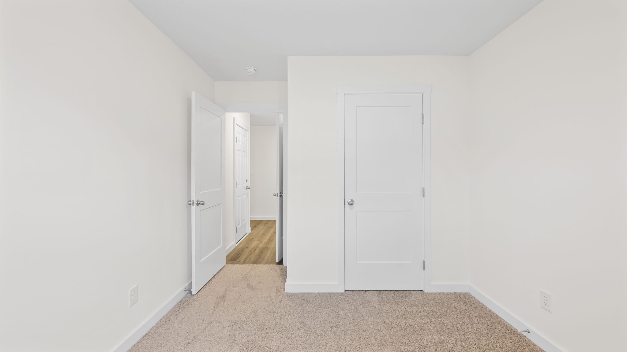 bedroom with single window and walk-in closet
