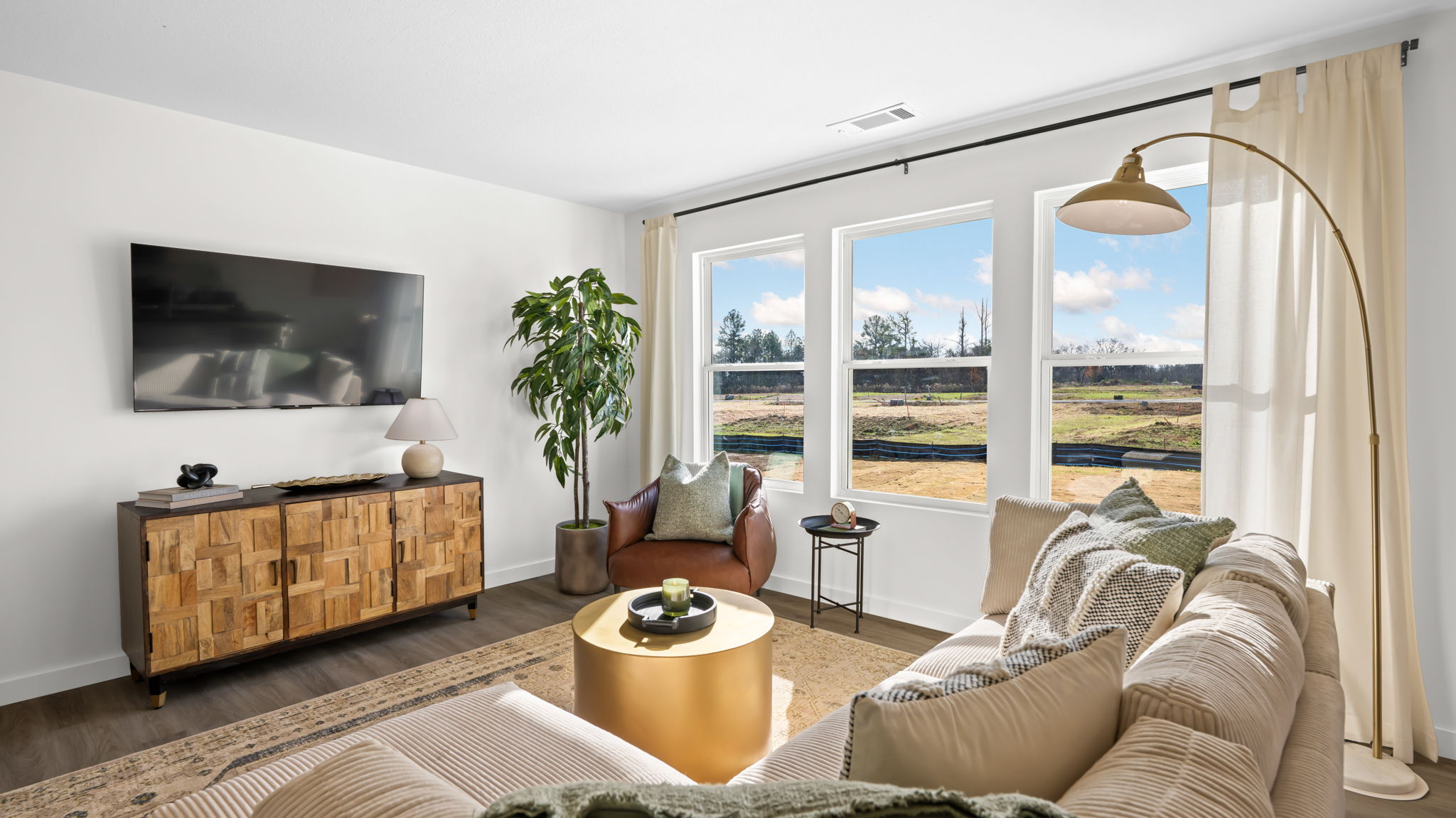 open concept living room with triple window