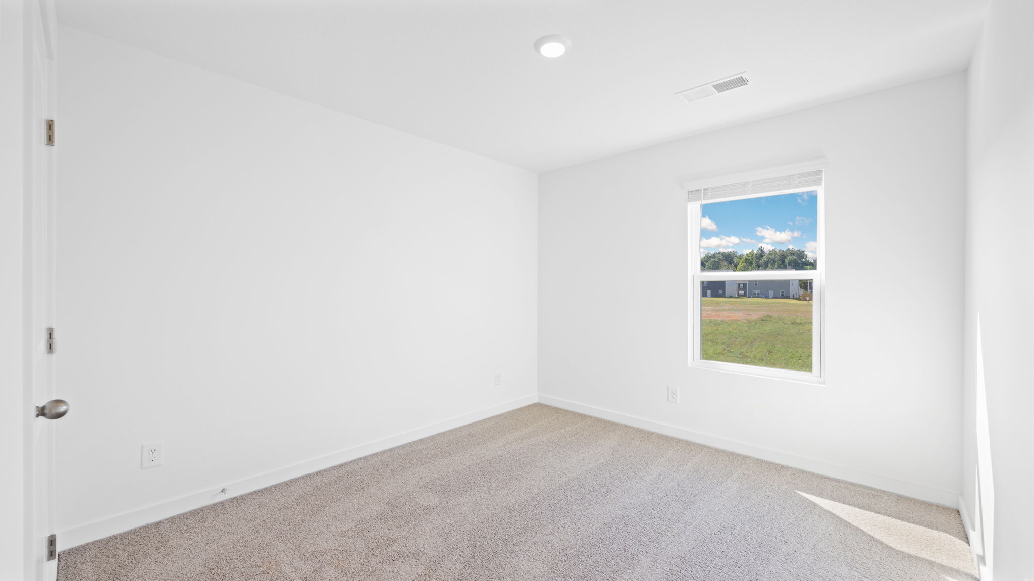 bedroom with single window and walk-in closet