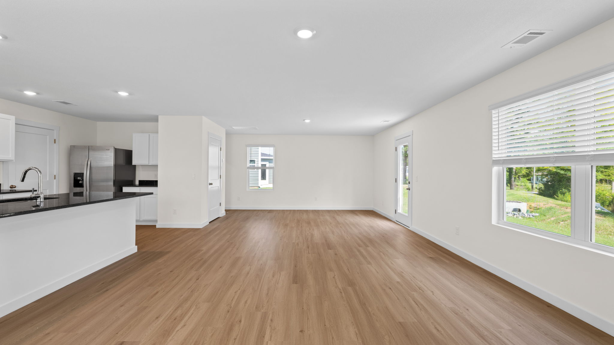 open concept living room with windows