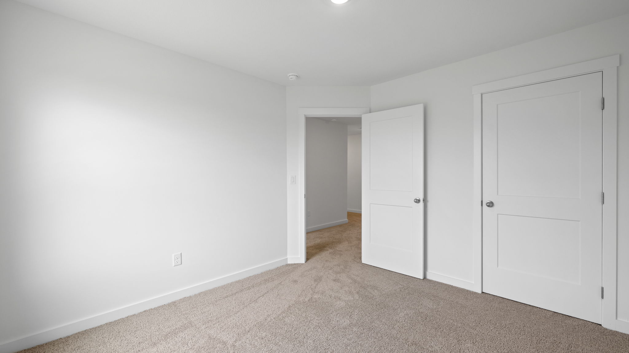 bedroom with white walls