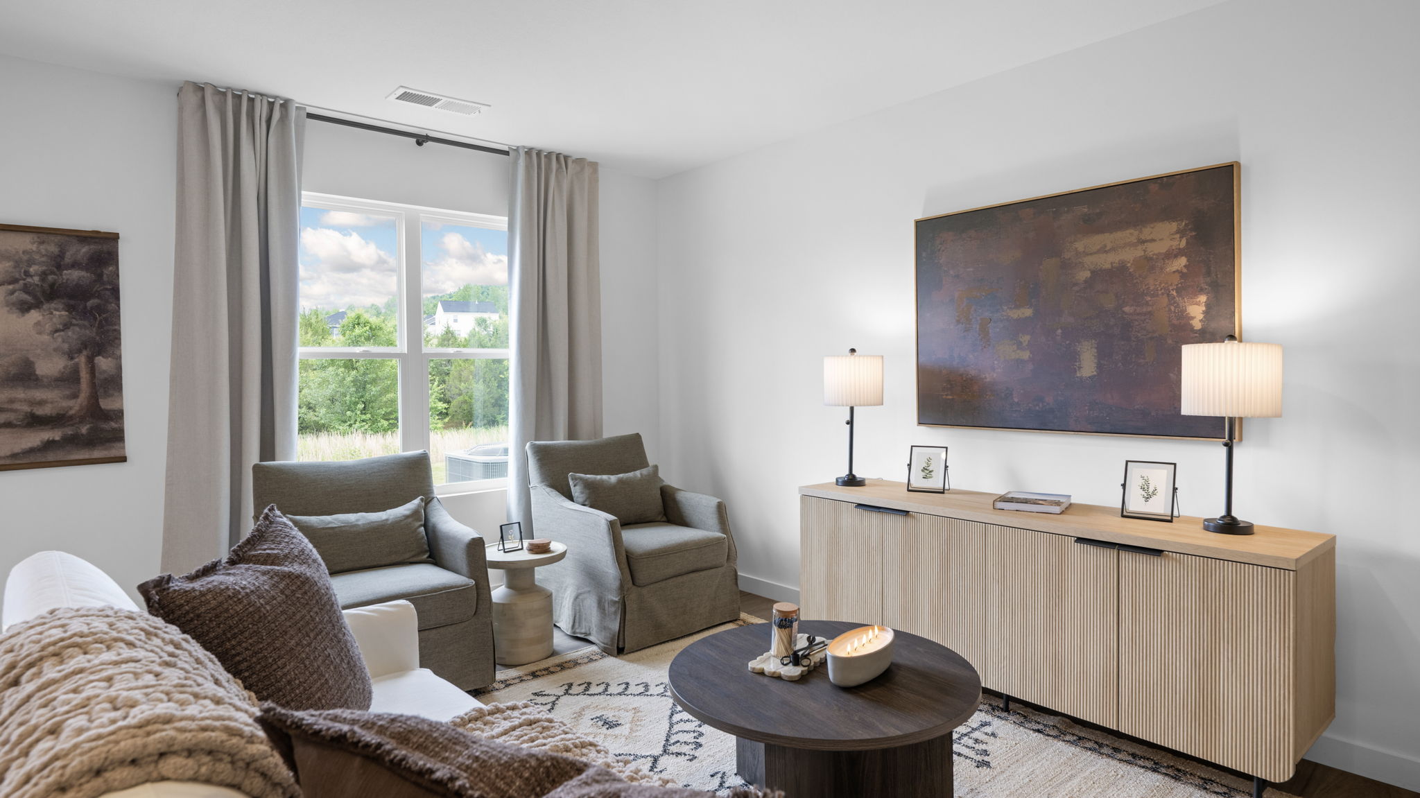 open concept living and dining with windows and back patio door