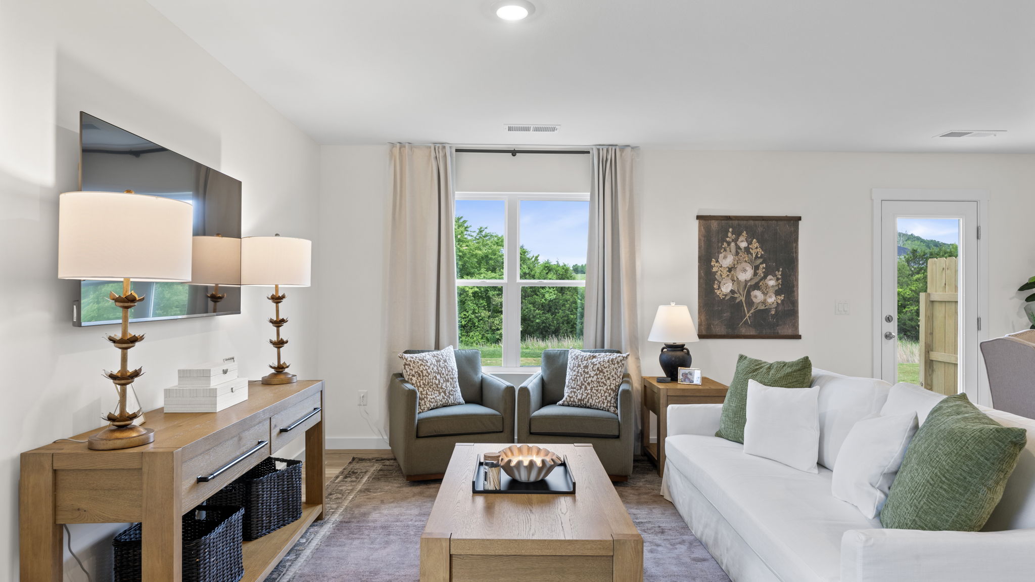 open concept living and dining with windows